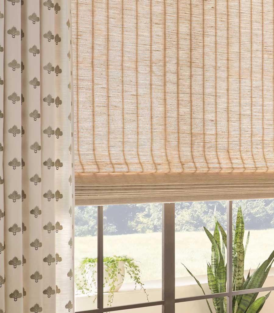 close up of pairing shades with drapery for stamped fabric and woven shades