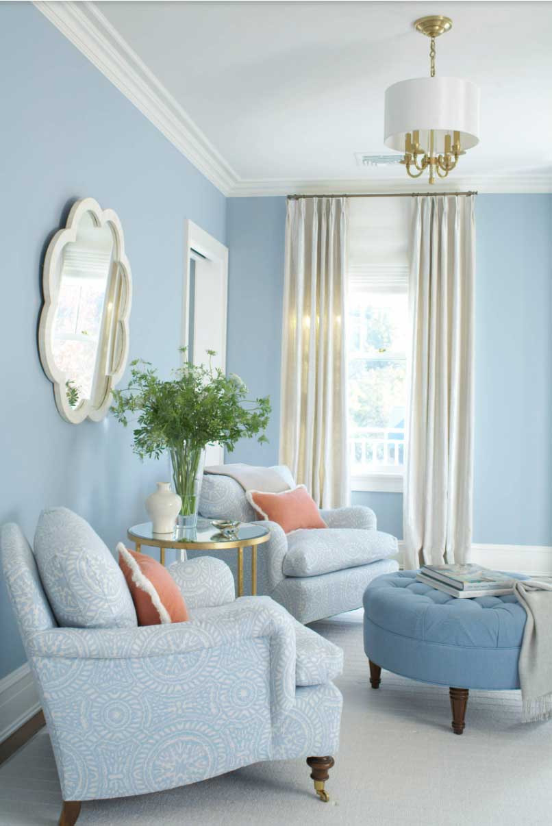 light blue living room with floor to ceiling drapery