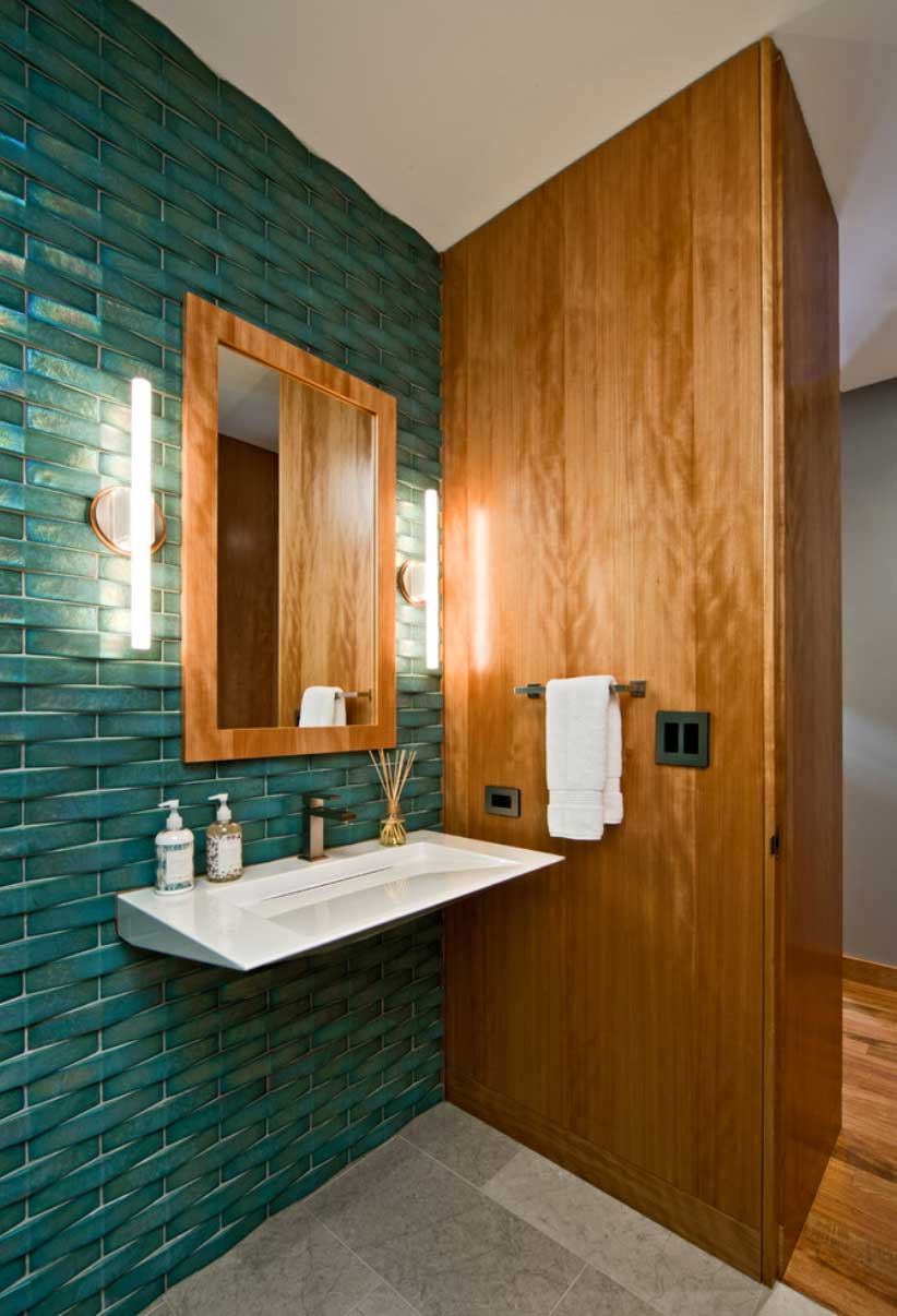 bathroom with turquoise tile wall