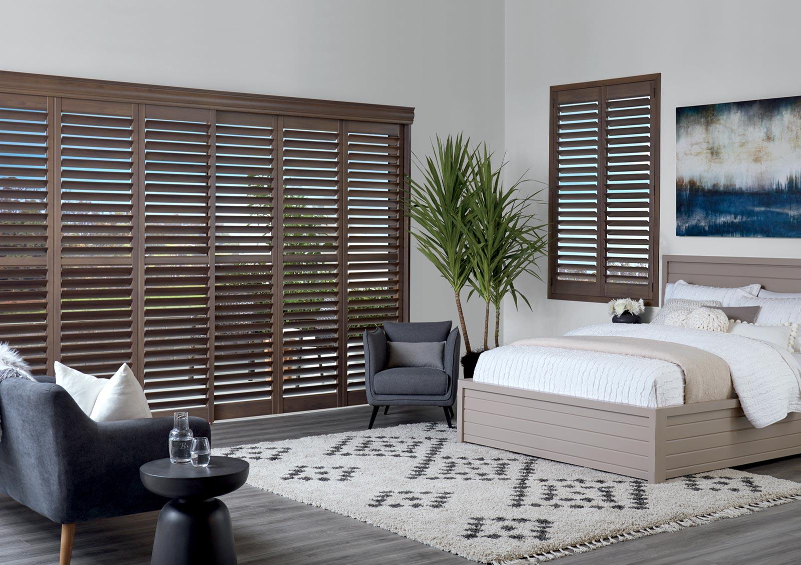 master bedroom with shutters neutral colors