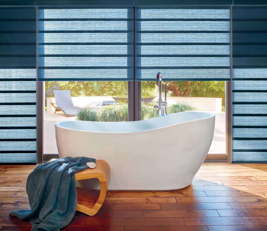 bathroom with floor to ceiling roman shades