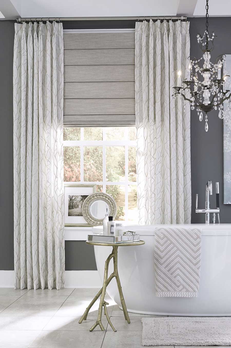 bathroom with roman shades and drapery